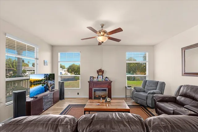 a living room with furniture and a large window
