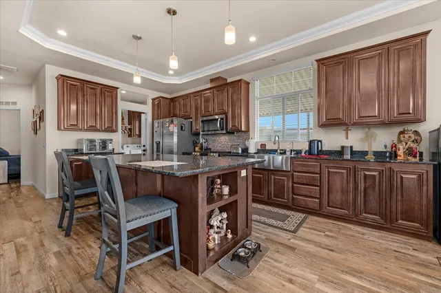 a kitchen with a sink cabinets and window