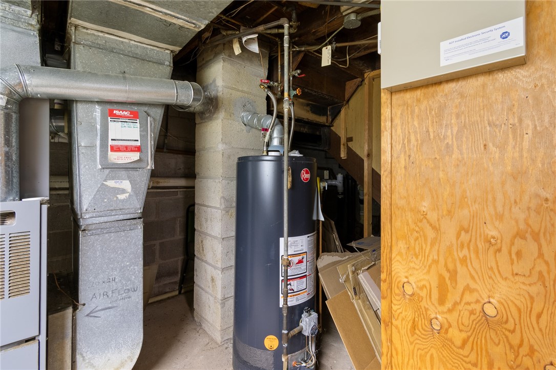 35 Banker Place Rochester, NY 14616 - Photo 39 of 45 water heater and furnace in the basement level