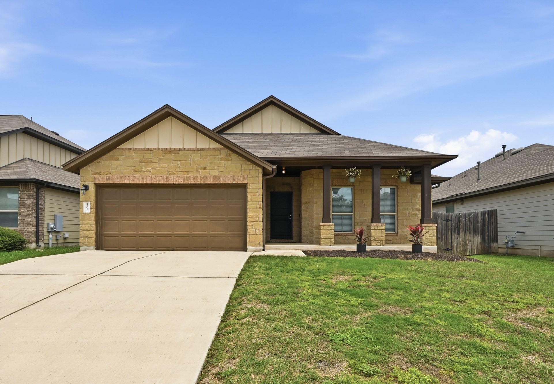 303 Limerick Road Buda, TX 78610 - Photo 1 of 23 Single-story residence featuring brick veneer and vertical siding accents