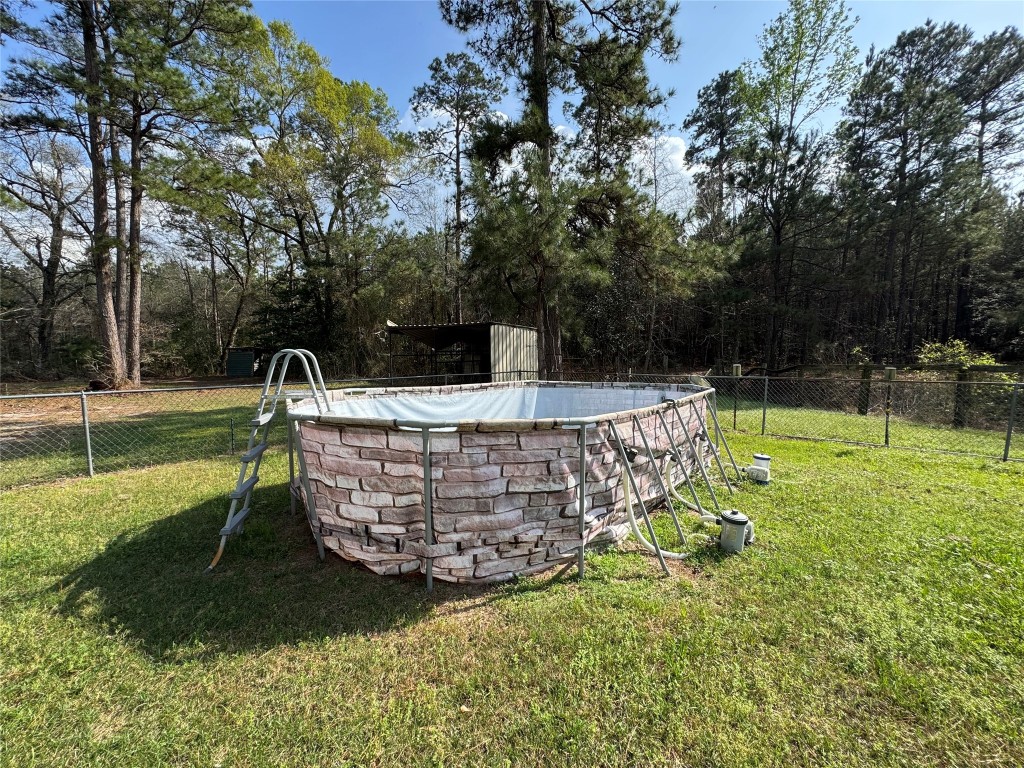 23278 Morgan Cemetery Road Splendora, TX 77372 - Photo 21 of 27 a view of a garden with a slide