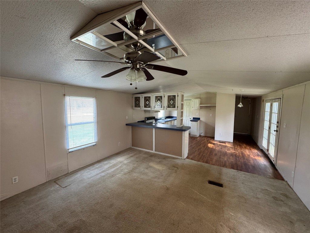 23278 Morgan Cemetery Road Splendora, TX 77372 - Photo 6 of 27 a view of a livingroom with a chandelier furniture and windows