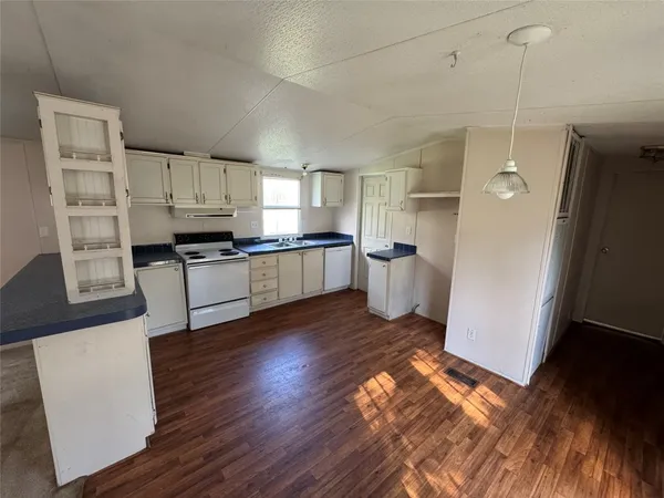 a view of a deck with a yard and trees