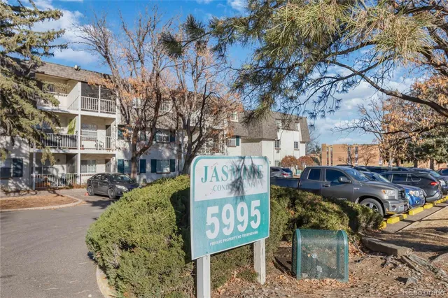 a view of a street with benches