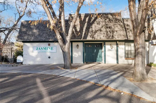 a front view of a house with parking space