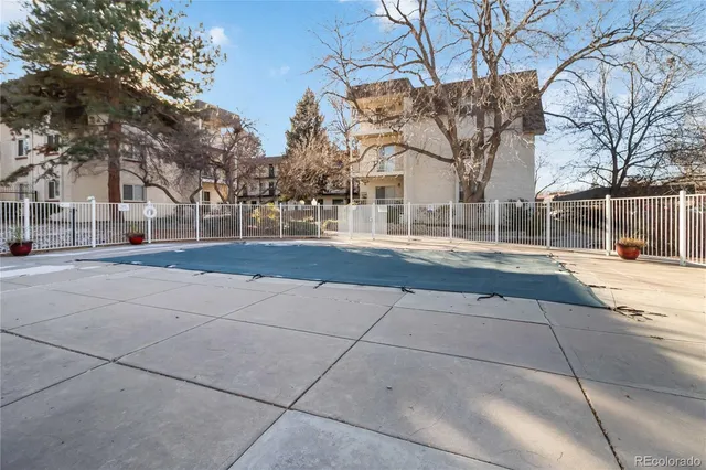 a view of a building with a snow on the road