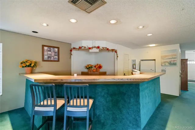 a kitchen with a table and chairs in it