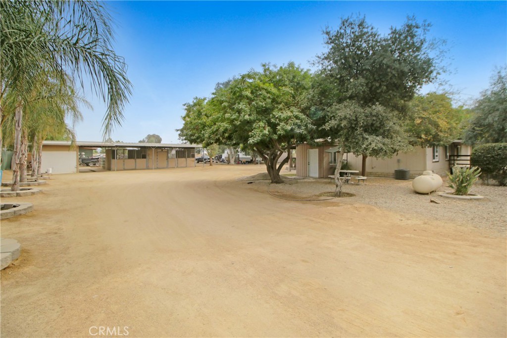 30620 Old Windmill Road Menifee, CA 92584 - Photo 12 of 14 a view of a swimming pool with a patio