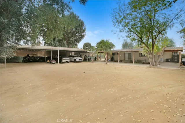 a view of a house with snow on the road