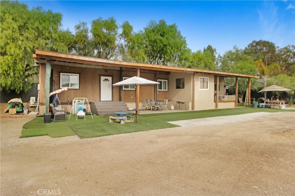 30620 Old Windmill Road Menifee, CA 92584 - Photo 5 of 14 a front view of a house with garden