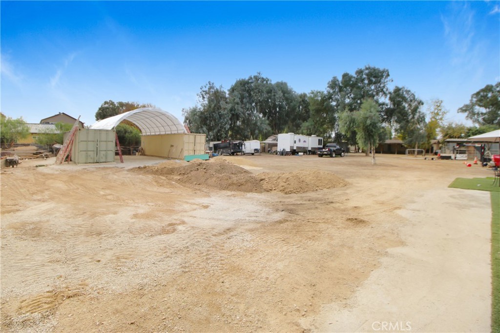 30620 Old Windmill Road Menifee, CA 92584 - Photo 7 of 14 a view of a yard with a tree