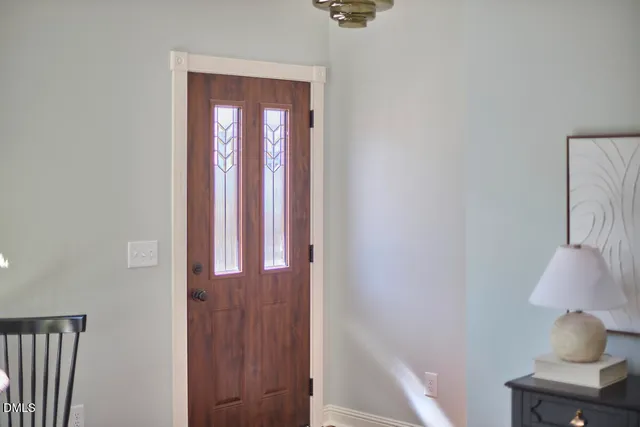 a living room with furniture a table and a potted plant