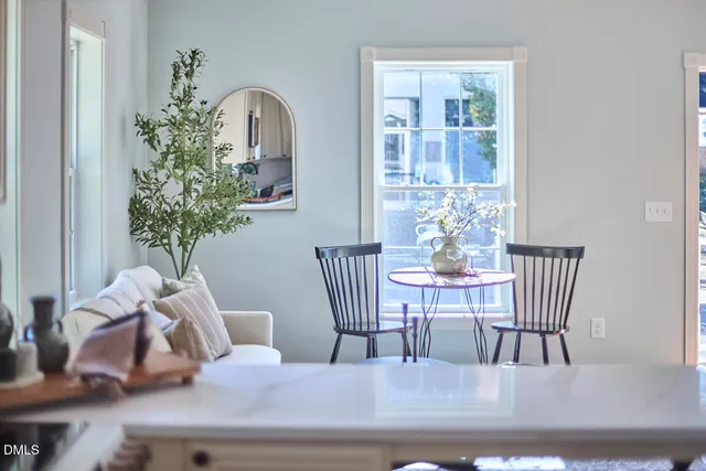 a kitchen with a sink cabinets and wooden floor