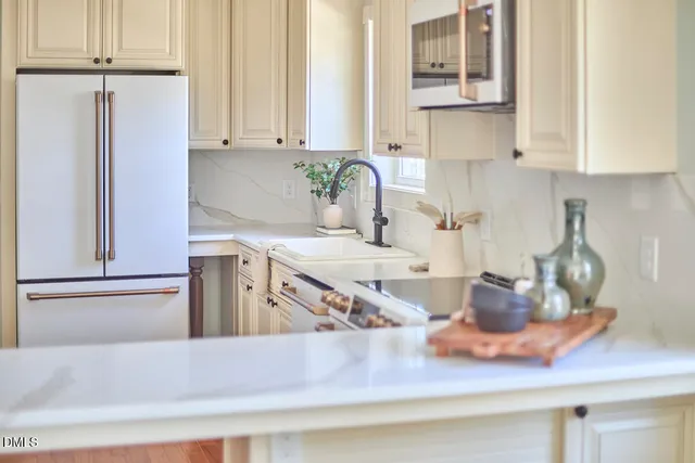 a close view of dining table with chairs