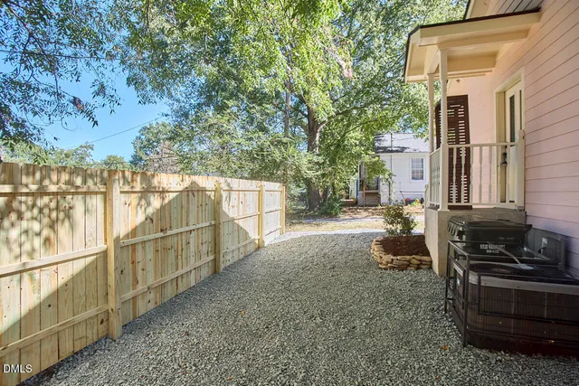 a backyard of a house with lots of green space
