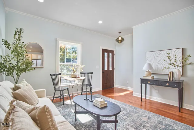 a living room with furniture and a table