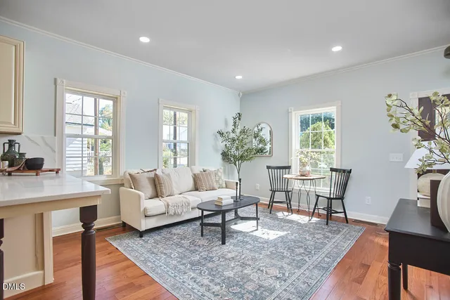 a living room with furniture and a table