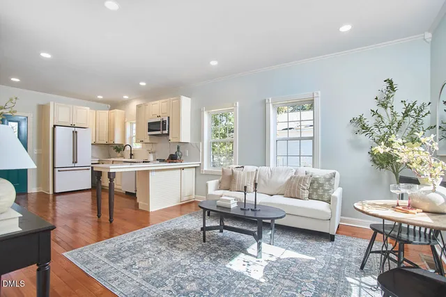 a kitchen with refrigerator cabinets and wooden floor