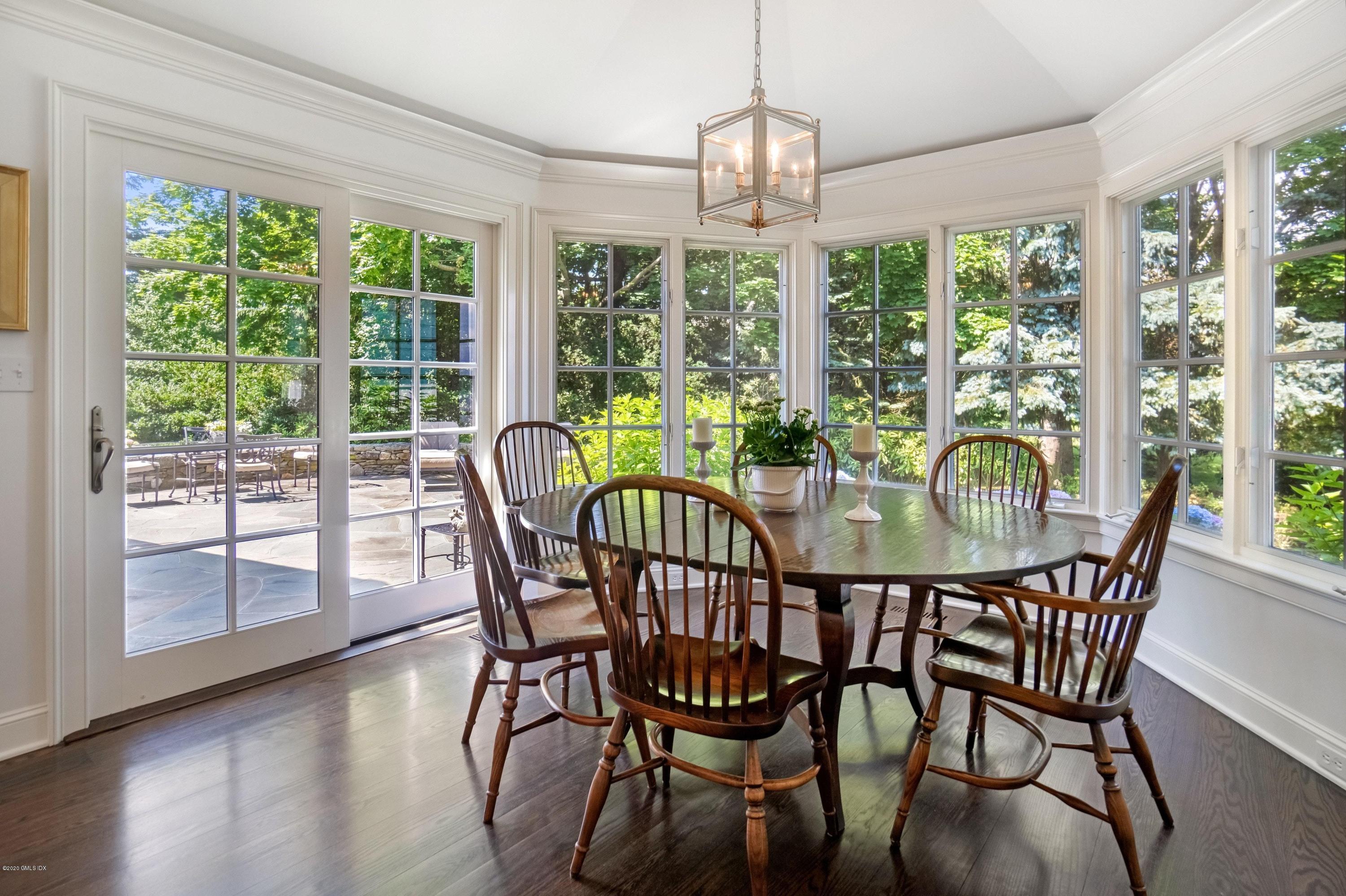 16 Marlow Court Riverside, CT 06878 - Photo 11 of 31 a view of a dining room with furniture window and wooden floor