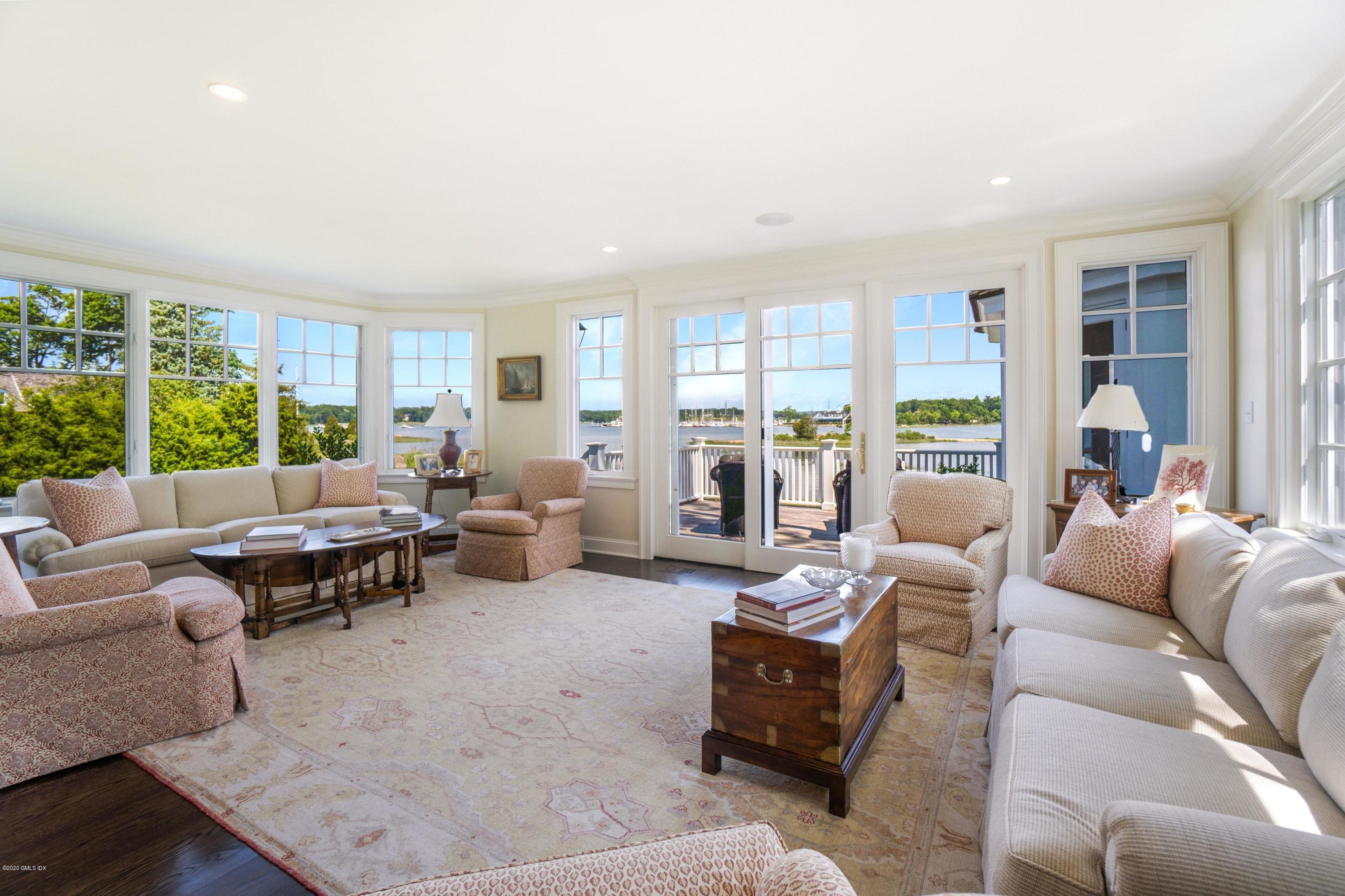 16 Marlow Court Riverside, CT 06878 - Photo 17 of 31 a living room with furniture and large windows