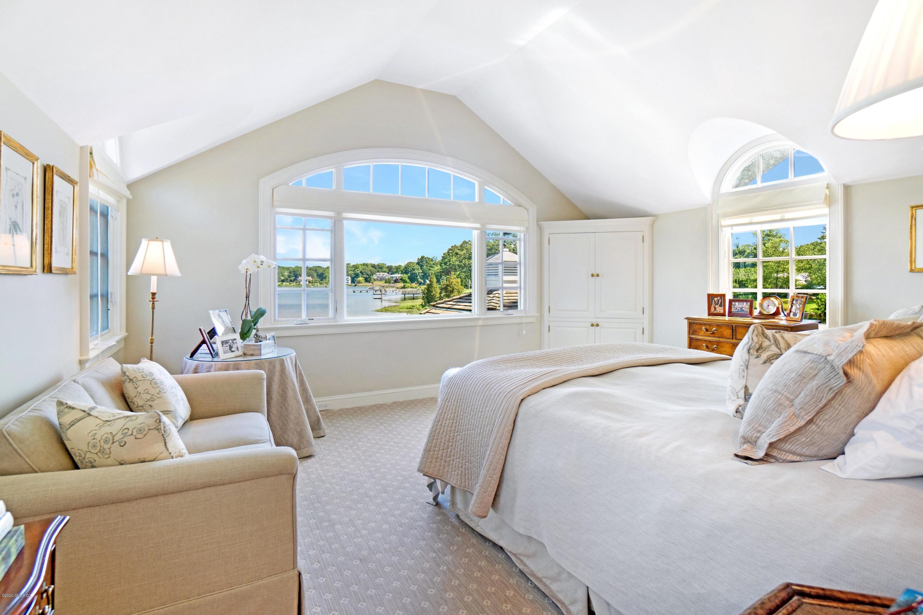 16 Marlow Court Riverside, CT 06878 - Photo 22 of 31 a bed room with a bed and a large window
