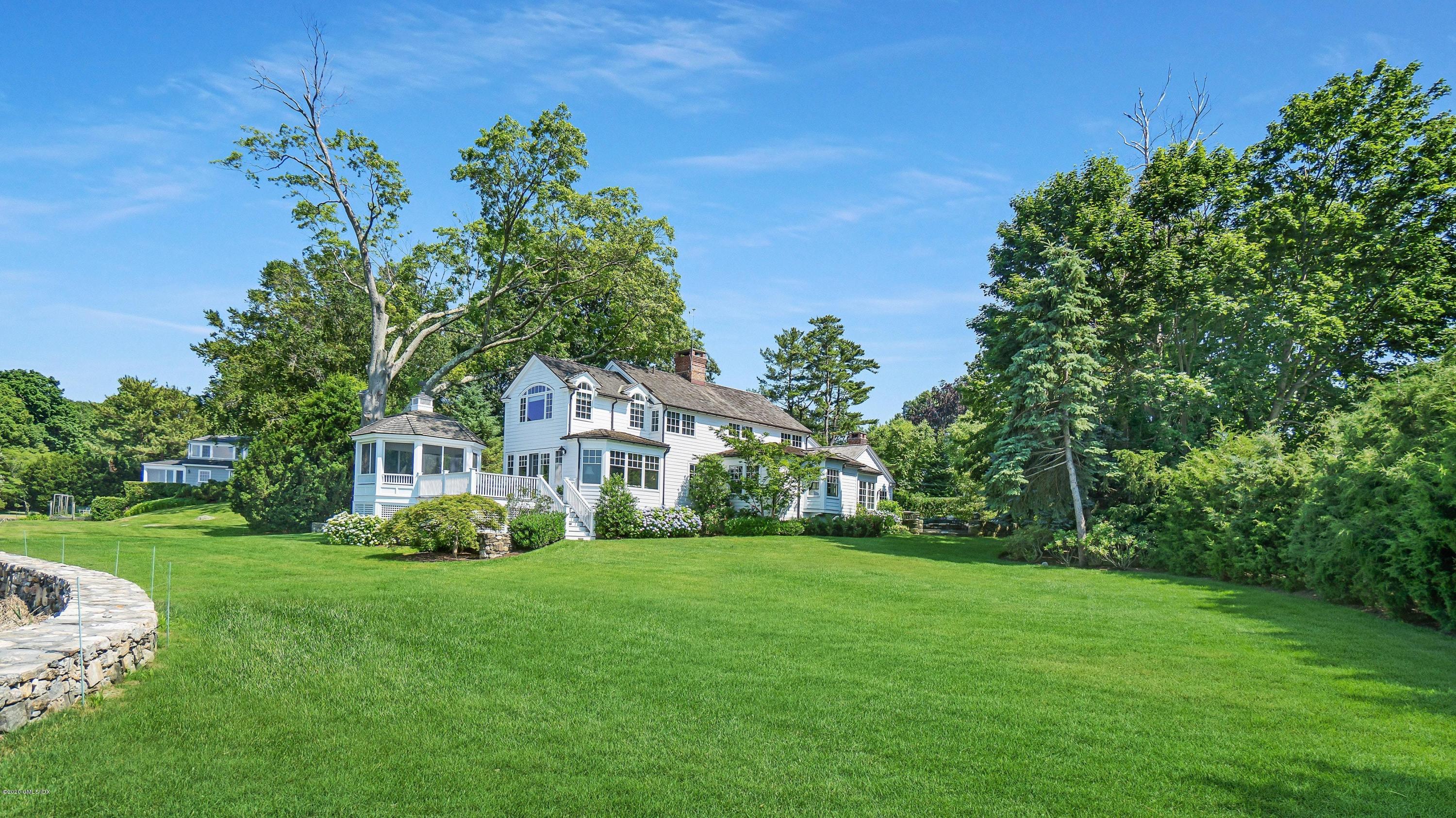 16 Marlow Court Riverside, CT 06878 - Photo 27 of 31 a front view of a house with a garden
