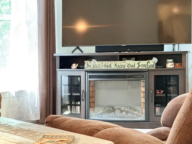 a living room with furniture and a flat screen tv