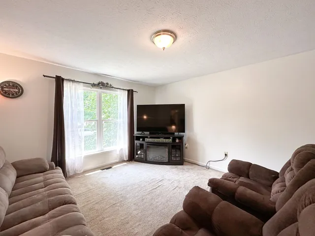 a kitchen with a sink stove and refrigerator