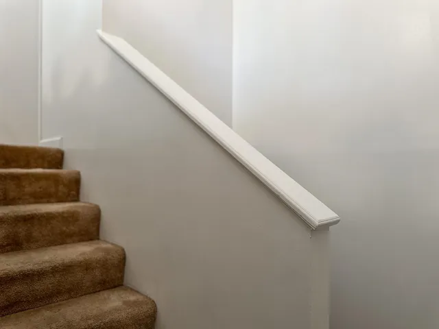 a view of a kitchen with a sink and a potted plant