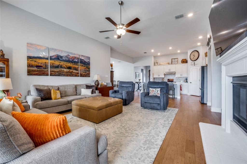 337 Augusta Court Oak Point, TX 75068 - Photo 11 of 26 a living room with furniture kitchen view and a chandelier