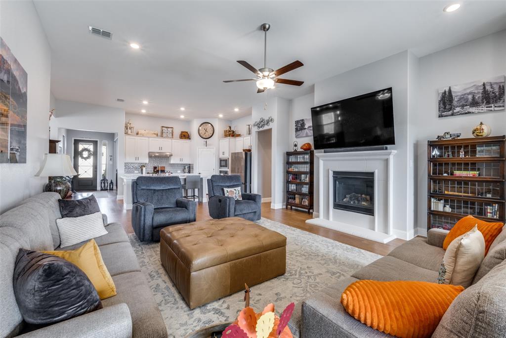 337 Augusta Court Oak Point, TX 75068 - Photo 12 of 26 a living room with furniture fireplace and flat screen tv