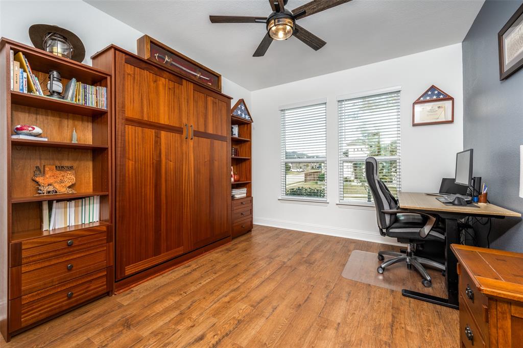 337 Augusta Court Oak Point, TX 75068 - Photo 4 of 26 a view of a workspace with furniture and a window