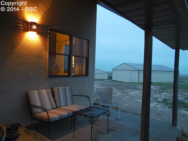 37285 Harrisville Road Calhan, CO 80808 - Photo 3 of 24 Enjoy The Views From The Covered Back Porch