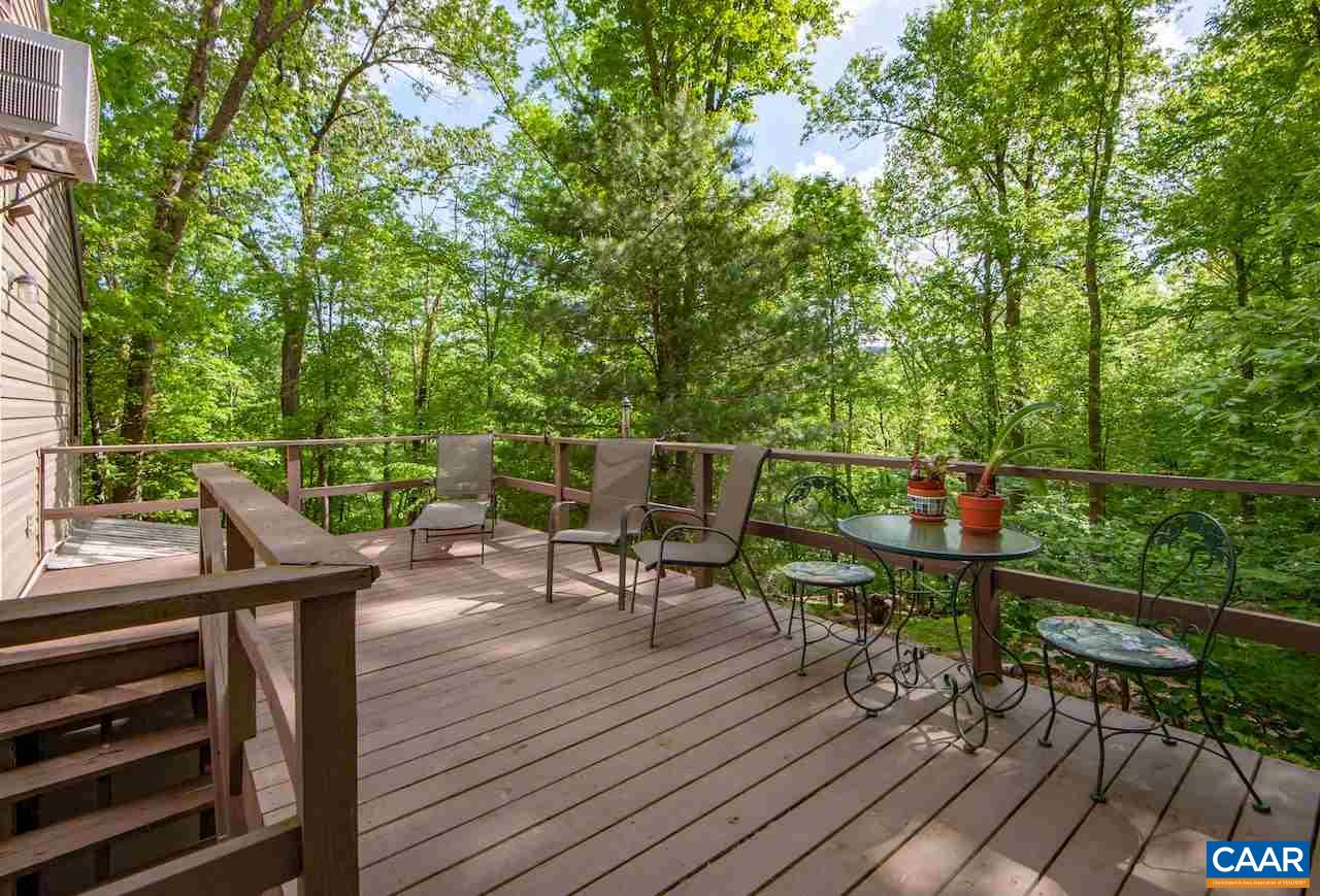 140 Rainbow Ridge Road Faber, VA 22938 - Photo 3 of 32 a view of a deck with wooden floor and outdoor seating