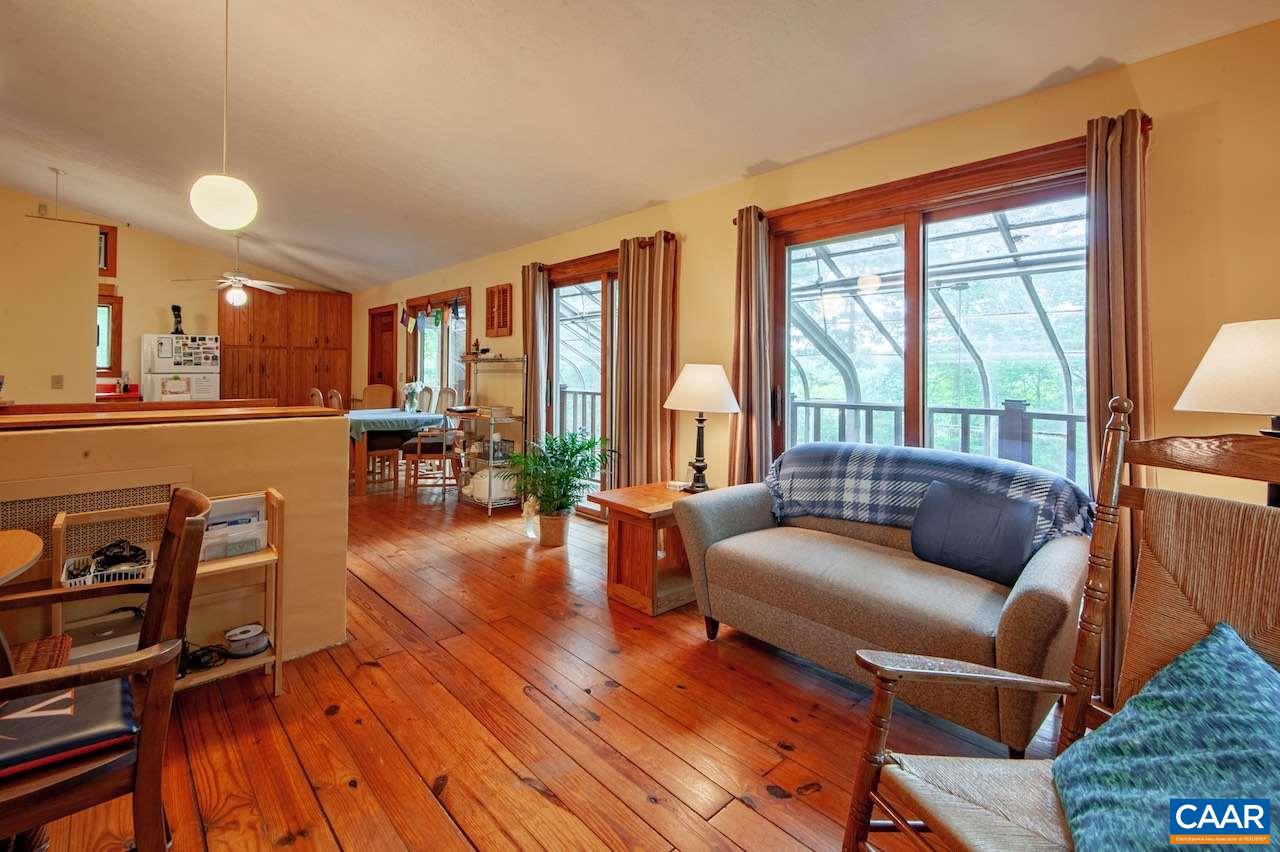 140 Rainbow Ridge Road Faber, VA 22938 - Photo 8 of 32 a living room with furniture and a large window