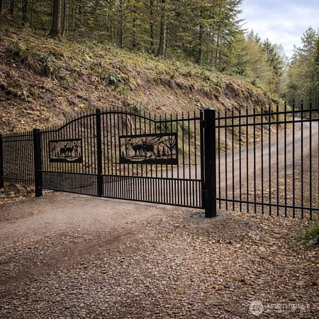 a view of a gate with a fence