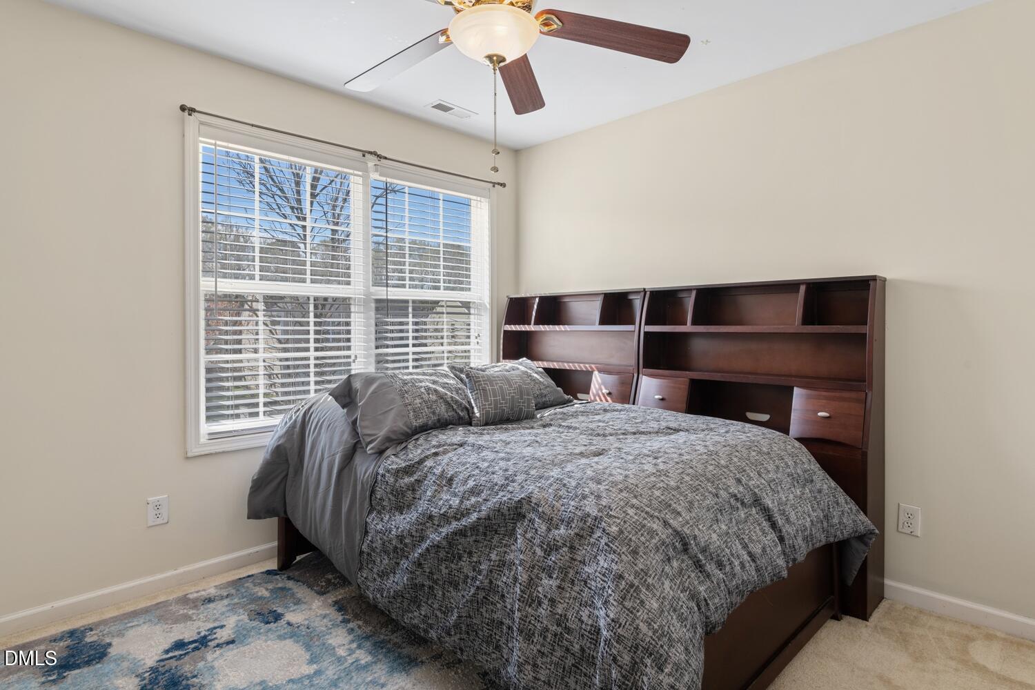 4113 Lady Slipper Lane Durham, NC 27704 - Photo 19 of 28 a bedroom with a bed and a window