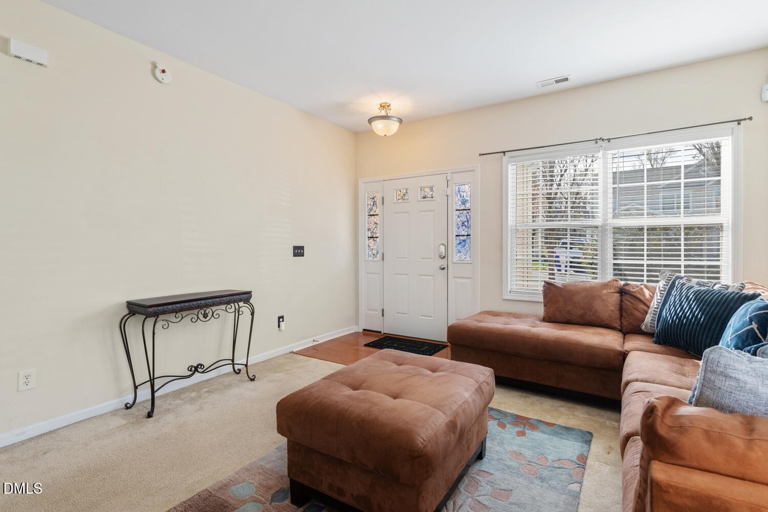 4113 Lady Slipper Lane Durham, NC 27704 - Photo 7 of 28 a bedroom with furniture and a window