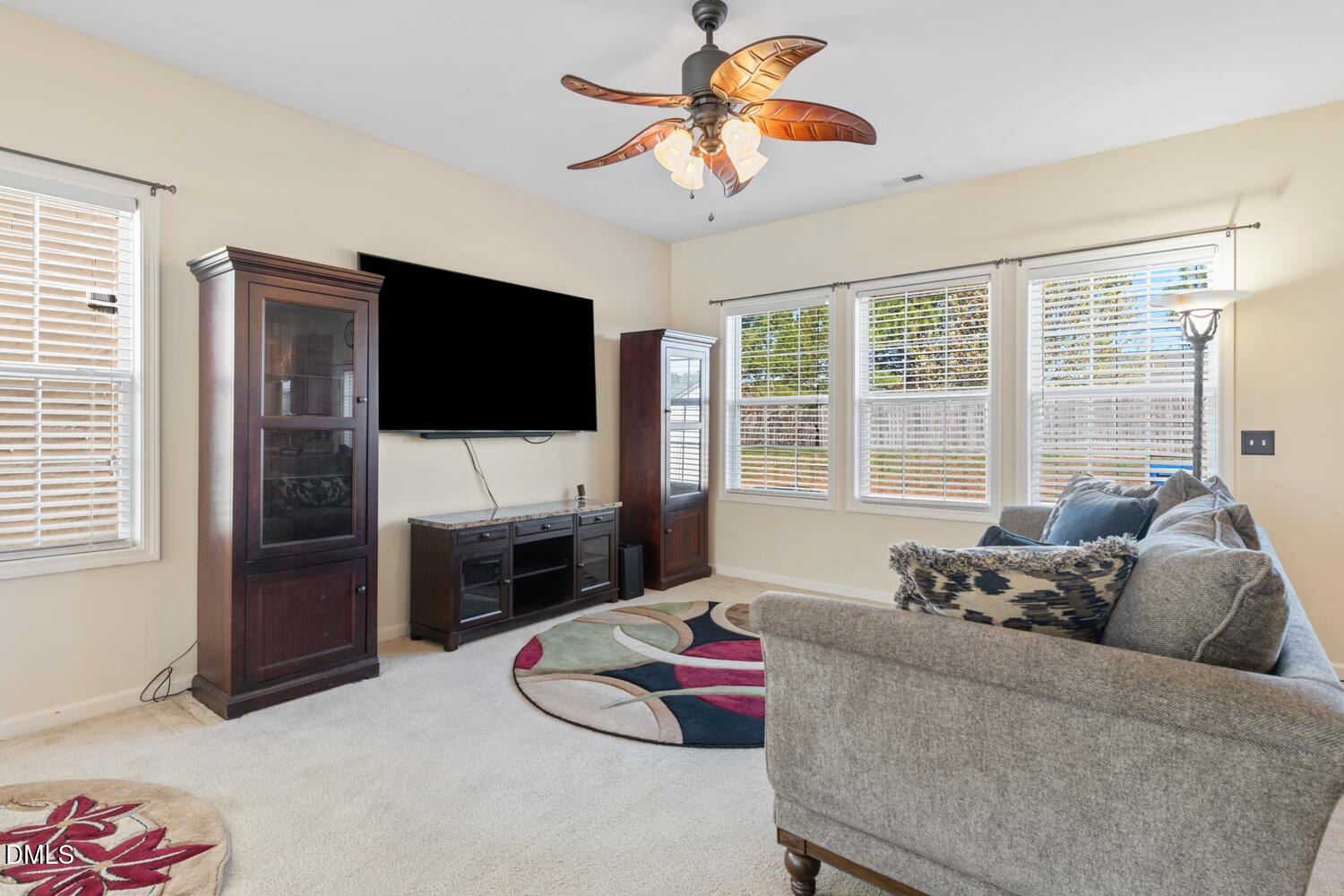 4113 Lady Slipper Lane Durham, NC 27704 - Photo 8 of 28 a living room with furniture and a flat screen tv