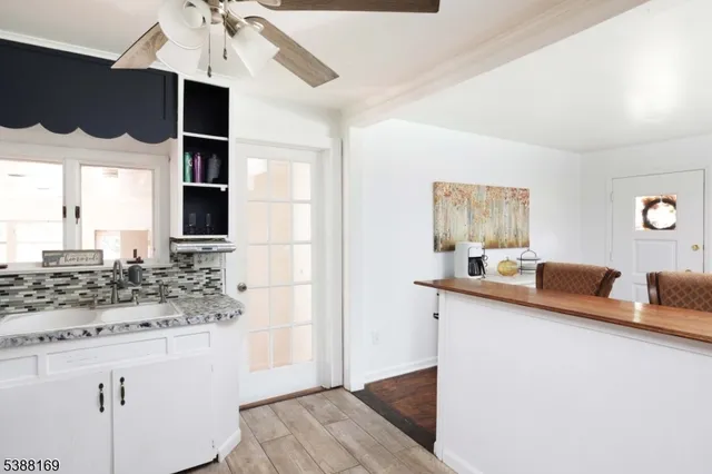 a kitchen with stainless steel appliances kitchen island granite countertop a sink and a stove