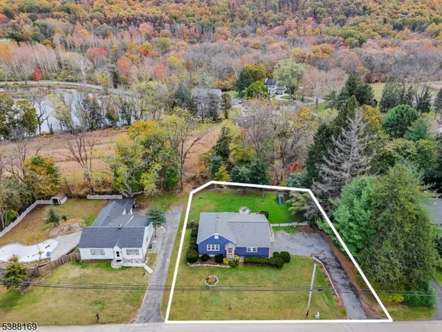 an aerial view of house with a swimming pool