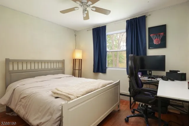 a bedroom with a bed and a desk