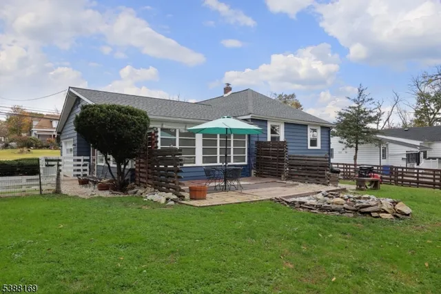 a view of a house with backyard porch and sitting area