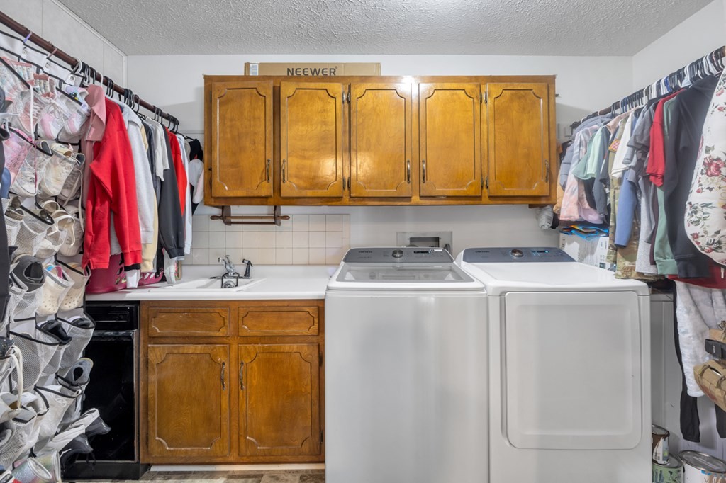 2580 Crofton Dawson Road Crofton, KY 42217 - Photo 11 of 50 a view of a walk in closet with clothes and shoes