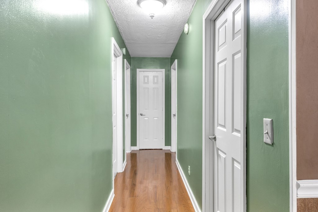2580 Crofton Dawson Road Crofton, KY 42217 - Photo 21 of 50 a view of a hallway with wooden floor and a bathroom