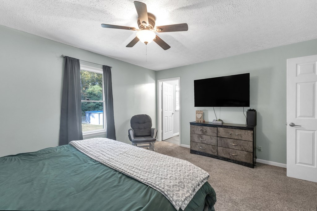 2580 Crofton Dawson Road Crofton, KY 42217 - Photo 25 of 50 a bedroom with a bed and a flat screen tv
