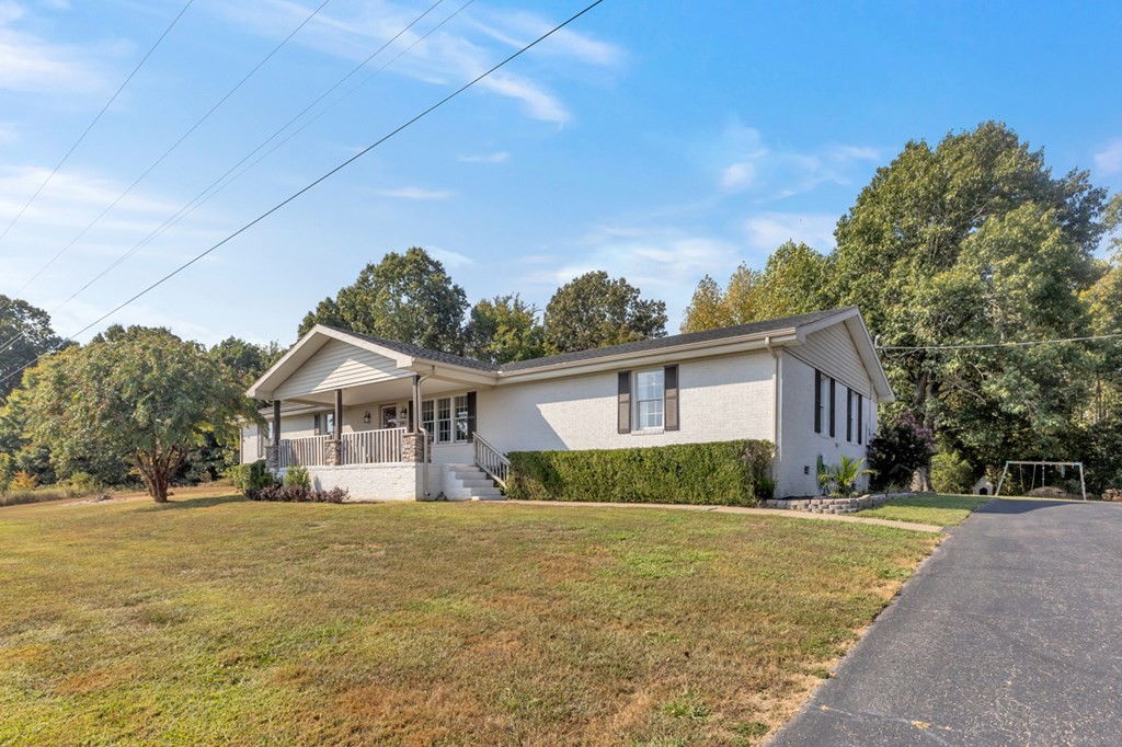 2580 Crofton Dawson Road Crofton, KY 42217 - Photo 30 of 50 a front view of a house with a yard