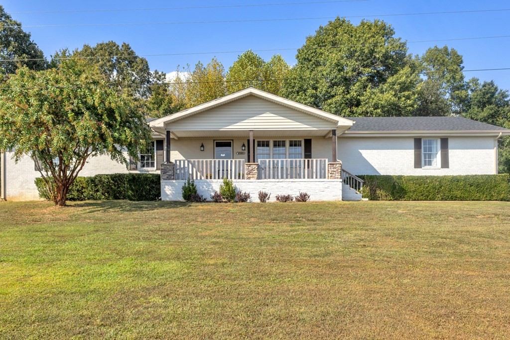 2580 Crofton Dawson Road Crofton, KY 42217 - Photo 39 of 50 a front view of a house with a garden
