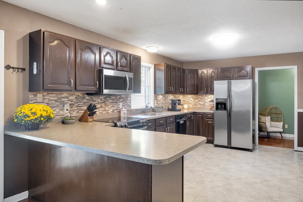 2580 Crofton Dawson Road Crofton, KY 42217 - Photo 6 of 50 a kitchen with stainless steel appliances a sink refrigerator and microwave