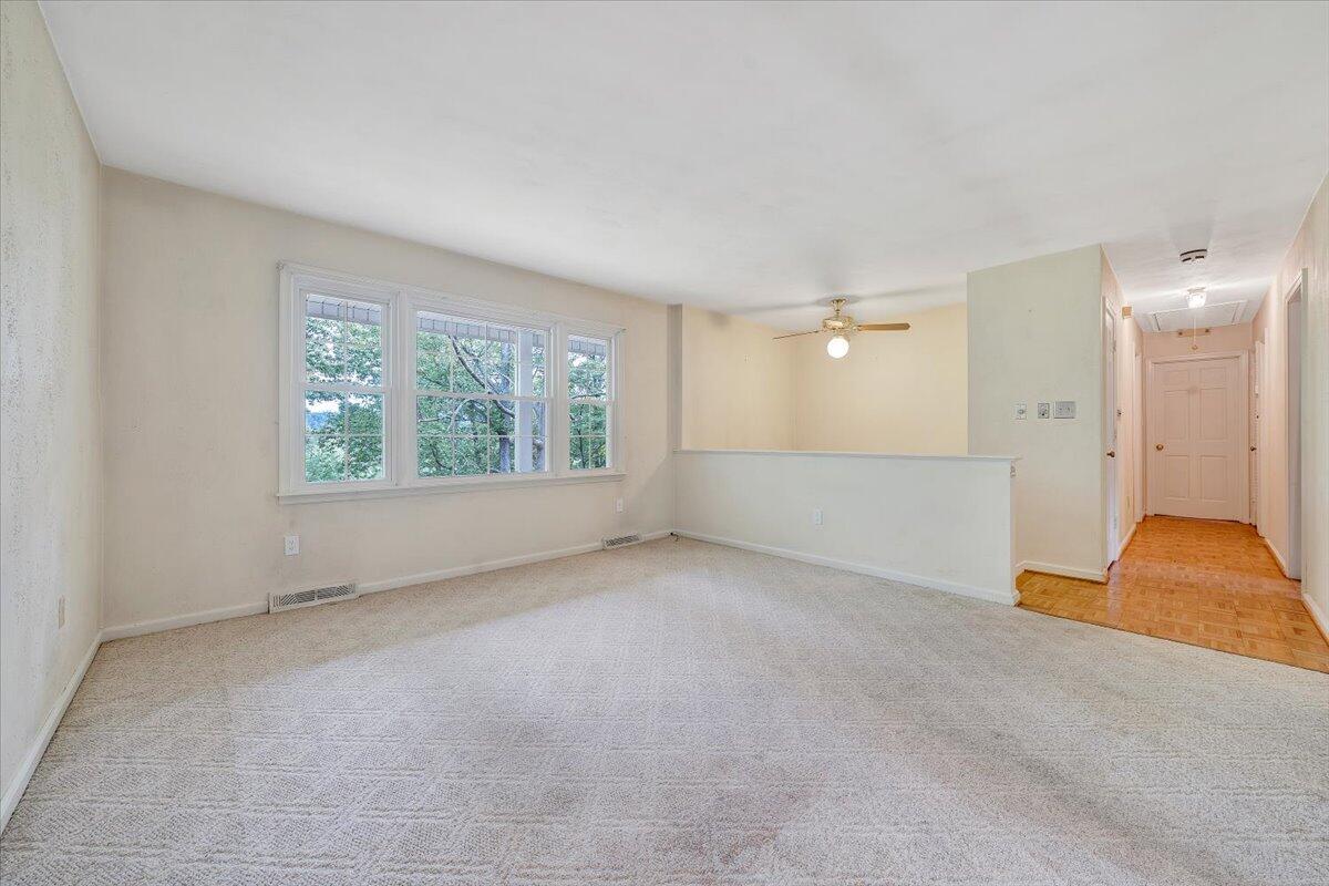 869 Lakeshore Terrace Road Hardy, VA 24101 - Photo 19 of 58 an empty room with a empty space and windows